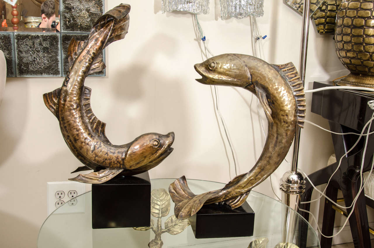 Pair of patinated metal fish sculptures